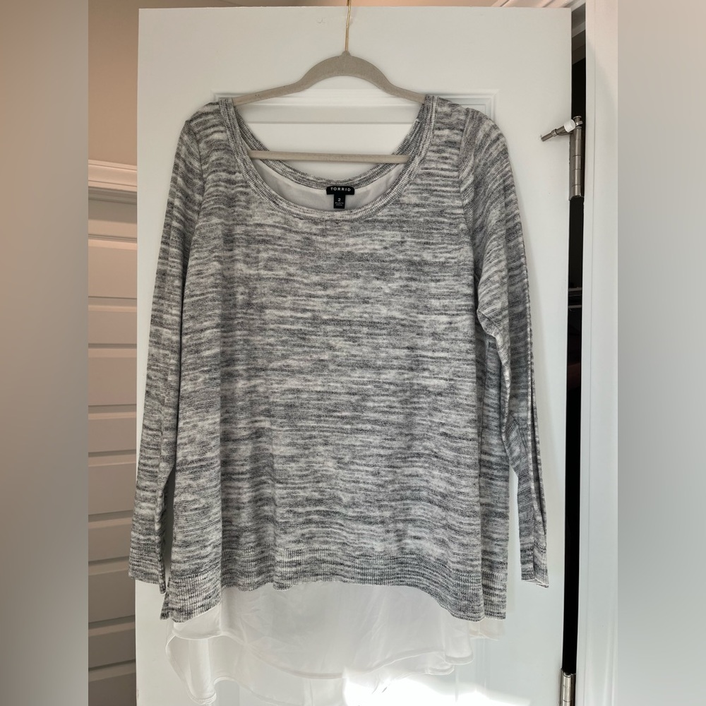 Grey and white sweater with white underlay and stitching down the back